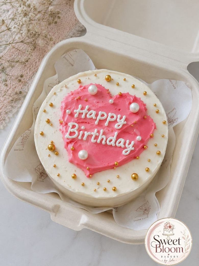 Pink heart bento cake with pearl sprinkles in a kraft box — Asansol