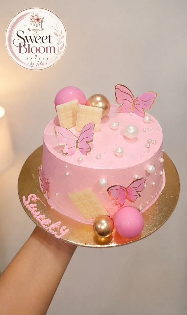 Pink butterfly theme cake with wafer butterflies and pearls — Asansol